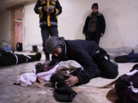 Parents in Syria's Ghouta search for children both dead and alive. /AFP Hamza Al-Ajweh 