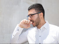 biting hand Arabic sign