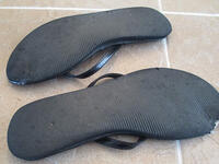 upturned slippers shoes soles facing heavens haram