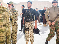 Jordan's team prepares for "Top Gun", an event where soldiers - shooting at distant targets with three different weapons - are judged for speed and accuracy. Finalists included Jordan and the US; Jordan ultimately placed first. Jordan and the US have long cooperated militarily, and jointly run this state-of-the-art training center.