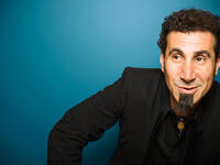 Serj Tankian, born in Beirut in 1967, is a singer-songwriter, composer, multi-instrumentalist, record producer, poet, and political activist, best known as the lead vocalist of the Armenian-American metal band System of a Down. Can he fit all that on a business card?
