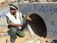 Gaddafi takes shelter in a drainpipe, but rebel fighters soon catch up with him and drag him to the street. Amateur video shows rebels sodomizing him with a pole or a knife. Gaddafi dies of bullet wounds soon thereafter, but it’s unclear who killed him. 
