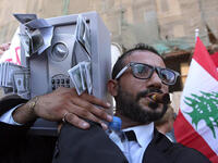 beirut protester dressed as a cash machine