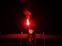 A protester holds a burning flare during a blocking of the ring road of Caen, northwestern France, on November 18, 2018 in Caen.
CHARLY TRIBALLEAU / AFP