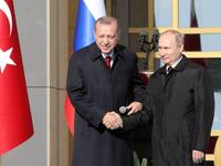 Famous handshake to remember as both Erdogan and Putin cement a working nuclear relationship, 3 April, (ADEM ALTAN / AFP)