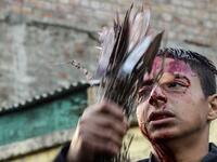 A Kashmiri Shiite Muslim mourner flagellates himself during a religious procession held on the seventh day of Ashura which remembers the slaying of the Prophet Muhammed's grandson in southern Iraq in the seventh century, in Srinagar on September 18, 2018. TAUSEEF MUSTAFA / AFP