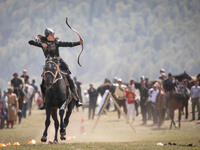 Woman competing in archery on horseback game (Shutterstock/File Photo)
