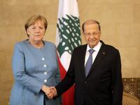 German Chancellor Angela Merkel (L) shakes hands with Lebanese President Michel Aoun at the presidential palace in Baabda, east Beirut, during her official visit on June 22, 2018. (AFP/Joseph Eid)
