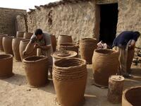 Iraqis making clay pots in Najaf on November 11, 2018. Pottery has deep roots in Iraq, where ancient civilisations turned to clay to build their homes, shape their cooking utensils, and even make their ovens.
Haidar HAMDANI / AFP