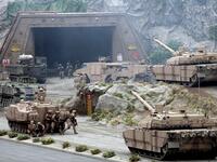 Members of the UAE Armed forces perform a military drill during the opening of the International Defence Exhibition and Conference at the Abu Dhabi National Exhibition Centre on February 17, 2019. 
AFP


