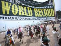 Pakistani horse riders during an attempt for a Guinness World Record for tent pegging in Khanewal district in Punjab province.
SS MIRZA / AFP