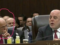 Diplomacy might not have been the first thing on the mind of this delegate seated next to Iraqi Prime Minister Haider al-Abadi - but he was definitely digging for something!
