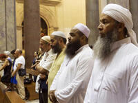 Muslims take part in a mass at the Basilica of the Holy Cross in Jerusalem on July 31, 2016 in Rome, Italy. The worshippers had also gathered to mourn the death of murdered French Priest Jacques Hamel. 