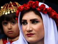 Yazidi women dress up on Charshema Sor or ‘Red Wednesday’ and visit cemeteries to offer presents to the dead whose spirits are believed to return to their graves. Presents include dishes, sweets, lamps and other things. 