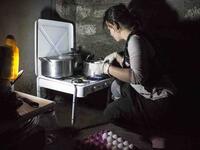 A Yazidi woman in the Khanke refugee camp in Iraq is boiling eggs to celebrate the new year. Eggs symbolize the earth, which is said to have been transformed from a liquid to a solid status, marking a new beginning of life. 