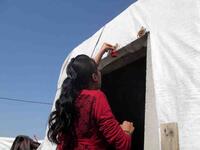 Broken egg shells, mud and anemone flowers are placed above the door of Yazidi homes, providing its residents with luck and fertility for the following year. 