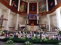 A shrine for Iraqi Christians who were killed in Al-Qaeda siege is erected at Sayidat alNejat Church in Baghdad  as Christmas for Iraqi Christian community will this year be a time of fear and cancelled celebrations instead of rejoicing following renewed threats by Al-Qaeda and the church massacre.