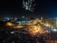 Fireworks light the sky as thousands of Egyptians gather to demonstrate against President Mohamed Morsi and the Muslim Brotherhood in Cairo's landmark Tahrir Square (AFP)