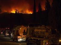 Israeli water tankers arrive to extinguish  a raging fire  in the city of Kiyriat Carmel, Carmel Forest