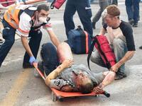 Israeli medics evacuate a burnt policeman from the site of raging fire in the Carmel Forest near Israel northern city of Haifa