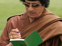 Gaddafi signs "The Green Book". The book is written by Gaddfi himself, contains controversial ideas about women, and it was first published in 1975.