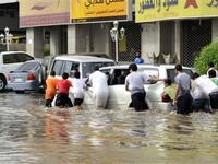 As many Saudi men gathered together for help, they succeeded to move the stuck car.