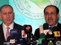 Iraqi Parliament Speaker Osama Al-Nujaifi (L) and Prime Minister Nuri al-Maliki hold a press conference in Baghdad.