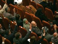 Iraqi MPs vote in parliament in Baghdad as lawmakers gave Prime Minister Nuri al-Maliki's government a vote of confidence and adopted a 43-point program aimed at liberalising the economy and fighting terrorism.