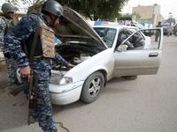 Iraqi troops implement strict security measures on main roads in Baghdad.