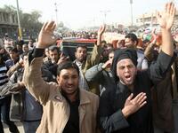 Iraqi Shiite Muslims carry the coffins of people killed in a bomb blast that targeted a convoy of pilgrims in the Ghazaliyah district of Baghdad.