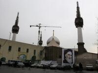 A poster of Ayatollah Ruhollah Khomeini, the late founder of the Islamic republic, adorns the Khomeini's mausoleum as people attend a ceremony marking the 32nd anniversary of his return from exile.