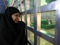 An Iranian woman visit the shrine of Ayatollah Ruhollah Khomeini, the late founder of the Islamic republic.