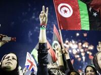 Libyans celebrate following the announcement of the liberation of the country in Martyr's Square in central Tripoli on October 
23, 2011 three days after ousted despot Moamer Kadhafi was killed.  Formerly Green Square, now Martyr's Square, saw bigger crowds during the Revolution, but  the occasion of freedom & a new Libya has drawn quite a crowd.