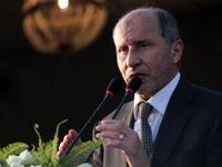 Libyan NTC leader Mustafa Abdul Jalil speaks during a ceremony announcing the liberation for the country. 
During a happy but somber speech in which he marked the heroic sacrifice of the dead fighters for Libya's freedom day, offering his sympathy for Turkey's earthquake victims, he hails the new age of peace, unity, and Islamic values.