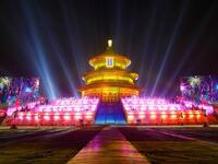The Temple of Heaven (The Qi Nian Temple) is illuminated as Beijing celebrates the New Year's Eve at the Temple of Heaven Park in Beijing, China.