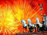 Fireworks explode over the Quadriga statue atop the Brandenburg Gate on New Year's Eve in Berlin, Germany. According to the media, up to one million people celebrate the country's biggest New Year's Eve Party.