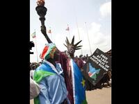 A South Sudanese man disguised as the Statue of Liberty of the US attends celebrations marking South Sudan's independence in Juba  as it seceded from the north and became the world's newest nation. 