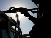 A UN peace keeper mans a machine gun as security remains tight.