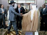 Qatari Minister of State for Foreign Affairs Ahmed bin Abdullah al-Mahmud (C-R) shakes hands with South
Sudan leader Salva Kiir as he arrives with Djibril Bassole, chief negotiator for the UN and the African Union for a meeting in south Sudan's regional capital Juba.