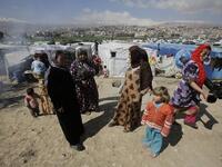 Women at a makeshift camp in Lebanon