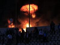 Flames rise from Cairo Stadium early in the match, Zamalek v. Ismaili clubs. Port Said has had wide repercussions just a day after, with Al Ahly Portuguese coach quitting, Port Said's governor resigning & the PM sacking officials from the EFA board. Top clubs Zamalek & Ahly have been disqualified, as well as the Premier League being suspended.