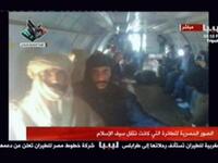 A shadow of the 'modern' accomplished well-traveled Saif who was mostly seen in Western business attire -- a suit and tie. Unlike his father who was known not to travel without his trusty Bedouin tent get-up and moreover tent-like tribal dress. Captured, Saif al-Islam appears the part of the loyal son to his theatrically attired murdered father.