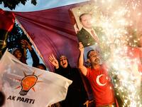 People react outside the Justice and Development Party (AKP) headquarters in Istanbul, on June 24, 2018, during the Turkish presidential and parliamentary elections, as President Erdogan won a new era. (Yasin AKGUL/AFP)