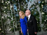 Media mogul Rupert Murdoch and wife Jerry Hall arrive in the “Booksellers Area” of the White House to attend a state dinner honoring France's President Emmanuel Macron on April 24, 2018 in Washington, DC. 
MANDEL NGAN / AFP