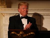 US President Donald Trump applauds during the State Dinner for French President Emmanuel Macron at the White House in Washington, DC, April 24, 2018. 
Ludovic MARIN / AFP