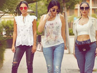 The Lebanese diva and her sisters sported casual looks with denim tight pants