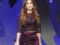 Al Zoghbi chose a trendy style that suits the evening with two pieces short and top that had a wide belt around