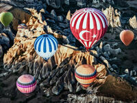 Colorful hot air balloons over mountain landscape in Cappadocia, Goreme National Park Turkey (Shutterstock/File Photo)