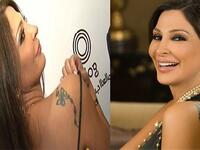 ملكة الرومانسية إليسا وشمت على كتفها تاتو على شكل فراشة.