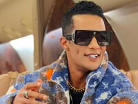 Moe Ramadan dances with flight attendant